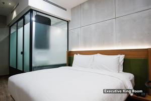 Postel nebo postele na pokoji v ubytování Ceria Hotel
