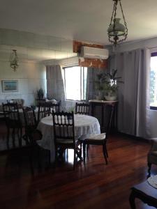 a dining room with a table and chairs in a room at Apartamento na Graça in Salvador