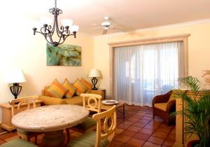 a living room filled with furniture and a table at Pueblo Bonito Rose Resort & Spa - All Inclusive in Cabo San Lucas