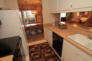 a kitchen with a sink and a counter top at Discovery 4 #125 in Mammoth Lakes