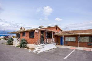 a brick building with a parking lot in front of it at Motel 6-Tremonton, UT in Tremonton