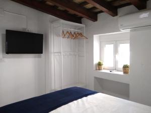 Łóżko lub łóżka w pokoju w obiekcie CH Apartments