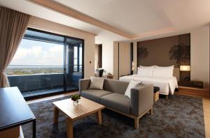 Katil atau katil-katil dalam bilik di MU Jiaoxi Hotel