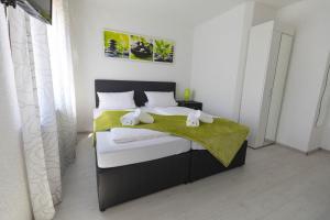 Postel nebo postele na pokoji v ubytování Hotel Berlin + 17 fotografií