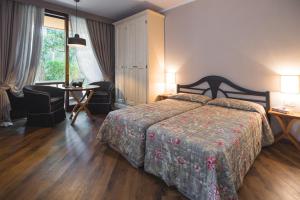 Postel nebo postele na pokoji v ubytování Roccamare Resort - Ville e Appartamenti
