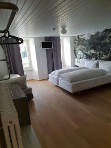 Rúm í herbergi á Hotel & Restaurant Forni