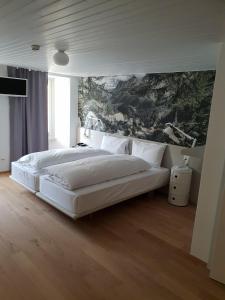 A bed or beds in a room at Hotel & Restaurant Forni