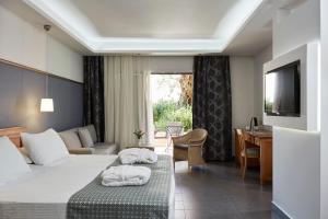 Postel nebo postele na pokoji v ubytování SENTIDO Apollo Palace