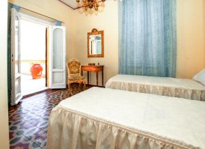 Postel nebo postele na pokoji v ubytování Villa Antiche Mura + 15 fotografií