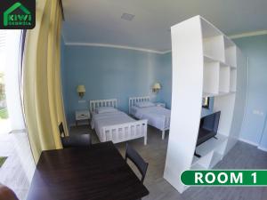 Ένα ή περισσότερα κρεβάτια σε δωμάτιο στο Kiwi Georgia