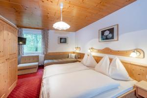 Postel nebo postele na pokoji v ubytování Gästehaus Herrmann