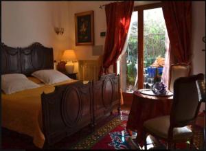 En eller flere senge i et værelse på Agriturismo Terre di Mare Bordighera