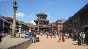 a group of people walking around a street in a city at Gaju Suite Hotel in Kathmandu