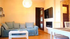 Telewizja i/lub zestaw kina domowego w obiekcie Lux Garden Apartment