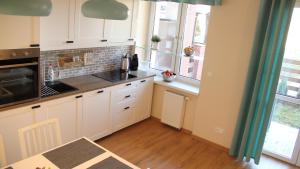Kuchnia lub aneks kuchenny w obiekcie Lux Garden Apartment