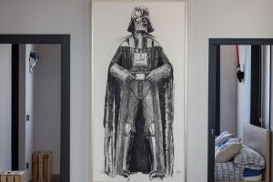 a drawing of a superhero on a wall at Star Wars Apartment in Salamanca