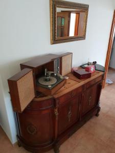 a wooden vanity with a sink and a mirror at Yard in Amora