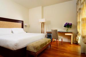 Cama ou camas em um quarto em UNA HOTELS Decò Roma