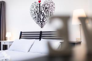 A bed or beds in a room at Bibi Home
