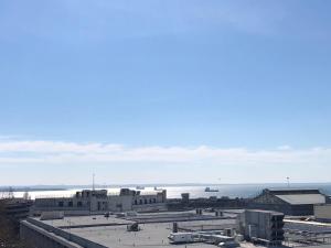 a view of a city with buildings and the ocean at Office-Studio Theoxaris in Thessaloniki
