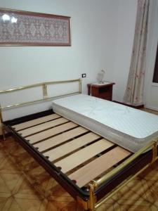 A bed or beds in a room at La Casa di Walter