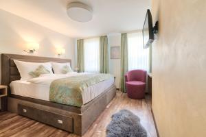 Postel nebo postele na pokoji v ubytování Hotel Tiffany