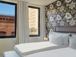 Postel nebo postele na pokoji v ubytování H10 Berlin Ku'damm + 37 fotografií