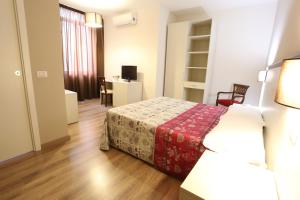 Postel nebo postele na pokoji v ubytování Hotel Europa