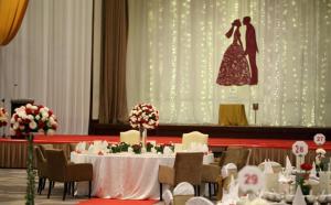 a table with a bride and groom on a stage at Better Residence Suite at Times Square KL in Kuala Lumpur +113 photos