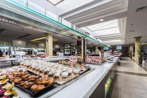 a buffet line with many different types of food at Royal Palm Resort & Spa - Adults Only in Playa Jandia