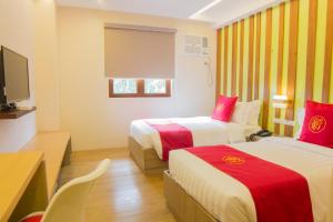 Katil atau katil-katil dalam bilik di Hotel Rosita