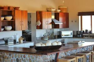 a kitchen with a counter with a bowl of eggs on it at Ribboksfontein Guest Farm in De Rust