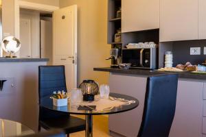 A kitchen or kitchenette at Top Floor Trastevere