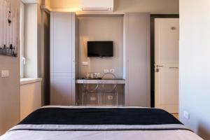 A bed or beds in a room at Top Floor Trastevere