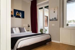 A bed or beds in a room at Top Floor Trastevere