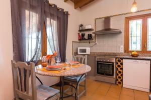 A kitchen or kitchenette at Can Gallu - Adults Only.