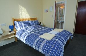 Postel nebo postele na pokoji v ubytování Lynmoore Guest House