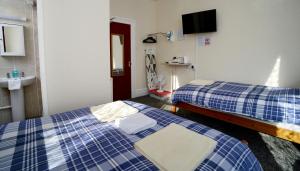 Postel nebo postele na pokoji v ubytování Lynmoore Guest House