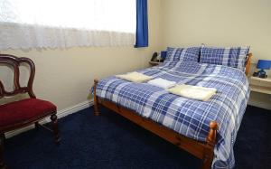 Postel nebo postele na pokoji v ubytování Lynmoore Guest House