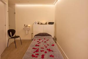 Posteľ alebo postele v izbe v ubytovaní Hotel Pompaelo Plaza del Ayuntamiento & Spa