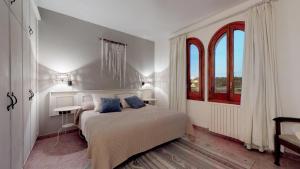 Postel nebo postele na pokoji v ubytování Mas Boronat Resort