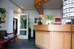 a shop with a counter in a room at Hotel Steensel in Steensel