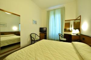 Кровать или кровати в номере Hotel Lamberti