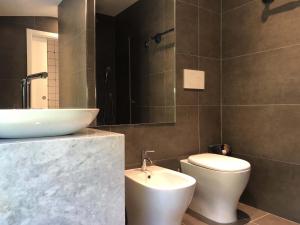 a bathroom with a sink and a toilet at VILLA DELLE ROSE CINQUE TERRE in Beverino +22 photos