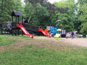 a park with a playground with children playing on it at Przy Mickiewicza in Dziwnów