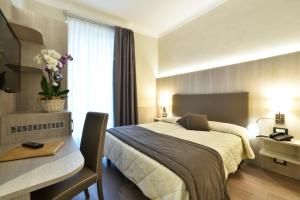 Кровать или кровати в номере Hotel Lamberti