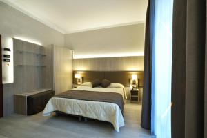 Кровать или кровати в номере Hotel Lamberti