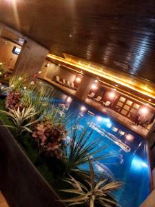 una vista aérea de una piscina por la noche en Family Resort Hotel, en Selimpasa