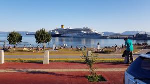 a cruise ship in the water with a group of people at Apart Hotel Alem in Ushuaia +7 photos