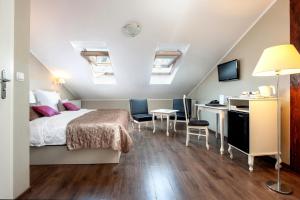 Łóżko lub łóżka w pokoju w obiekcie Leone Aparthotel
